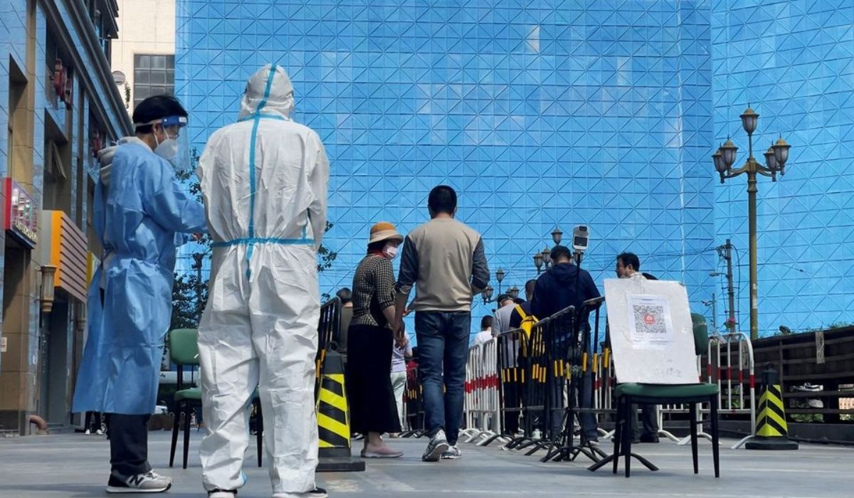 Workers in protective suits